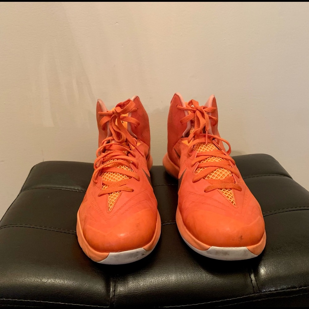 Bright orange Nike athletic shoes